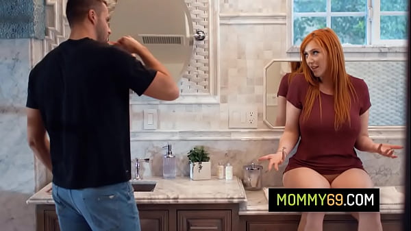 Gorgeous redhead stepmom Lauren Phillips greets her stepson naked and rides on his cock
